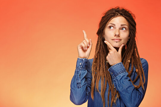 Portrait Of Pensive Young Woman Who Has Good Idea