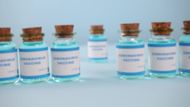 Flu Measles Coronavirus Vaccine. Covid-19 Coronavirus Vaccine Production Line, Cinematic Close Up Of Vaccination Manufacturing. Vial. Biontech Pfizer Moderna Novavax Curevac Astrazeneca Vaccination.