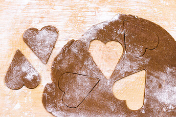 Cookies dough background. Cookies dough cut heart forms. valentine’s day and holiday sweet background.