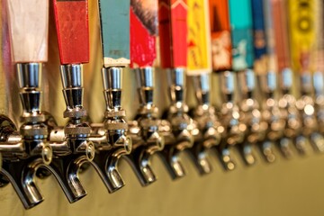 colorful beer taps in a row