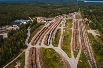 Hyrynsalmi railway yard with log wood waiting for railway transport to saw mills, Finland - 398959941