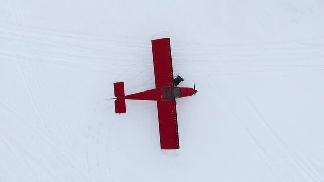 Light aircraft on top. The red plane.