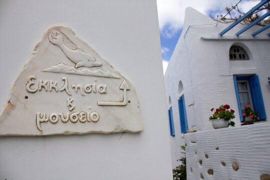 Street sign made of marble leads to church and museum at the traditional village of Volax in Tinos island, Greece, April 20 2014.