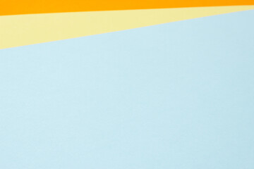 Colorful paper geometry background with blue, yellow, orange colors.