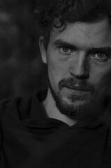 
black and white portrait of a guy with usmi and a beard