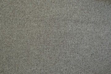 Grey (gray) color fabric detail carpet or cardboard texture background for architecture or interior design. Concept grey wool textured cloth is trendy color 2021. Selective focus.