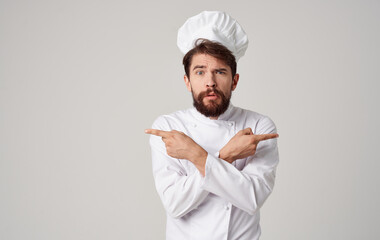 Male cook Professional working in the kitchen preparing food