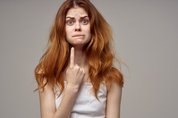 Naklejka premium woman with loose hair acne on her face acne gesturing with her hands