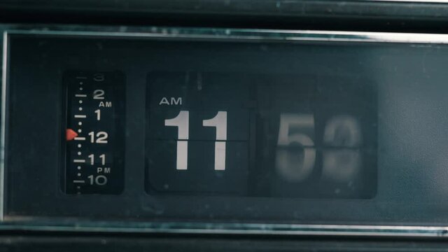 Vintage retro flip clock with the time advancing at a very fast pace showing how time passes fast. Old-style radio analog clock.