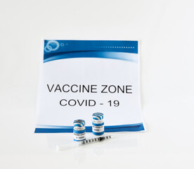 Vaccine Zone Covid-19 Vaccine bottle and syringe for injection and mask on a white background