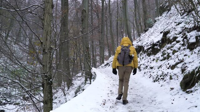 Image of man winter hiking at medvedgrad trail, Zagreb, Croatia.