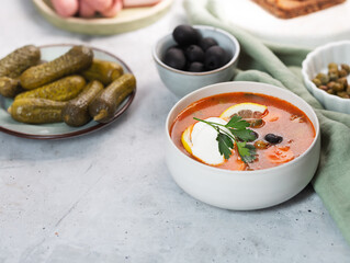 Solyanka, Russian soup with sausage, olives and capers
