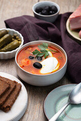 Solyanka, Russian soup with sausage, olives and capers