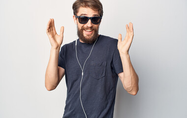 man in sunglasses wearing headphones listening to music lifestyle