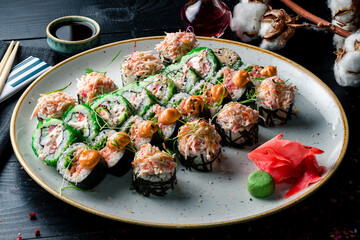large colorful set of sushi in round plate, sushi set on a large plate