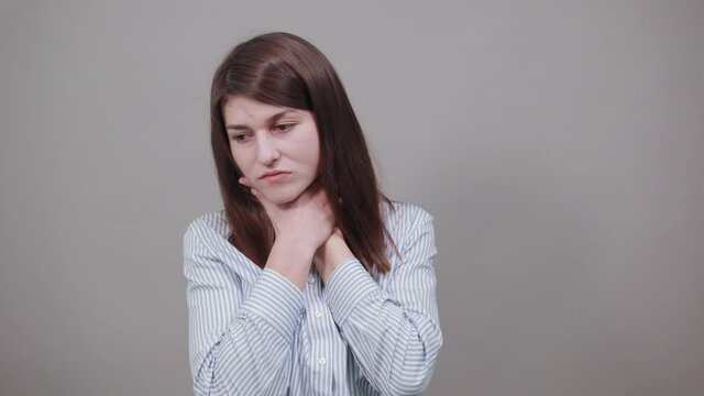 hands around throat, screaming, panicking in trouble as chokes on food stuck and is making the official international sign for I am choking, placing fingers at neck outstretched, olive pit, asthma