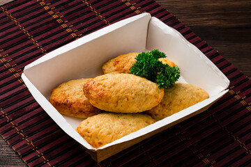 chicken cutlets with herbs on a dark wooden background, homemade chicken cutlets Free copy space