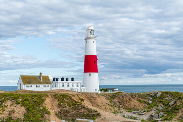 Portland Bill Lighthouse. Dorset coast in Isle of Portland, UK. A sea way-mark guiding vessels navigating in the English Channel.