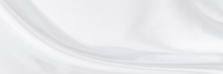 White gray satin texture that is white silver fabric silk background with beautiful soft blur pattern natural.