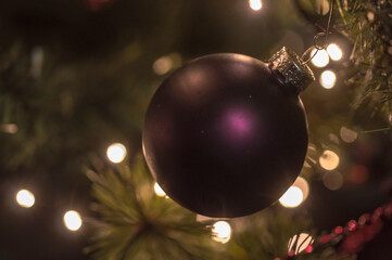 Close up picture of a purple Christmas ornament