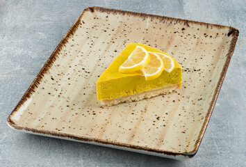 A slice of lemon cheesecake.