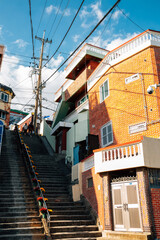 Fototapeta na wymiar Choryang Ibagu-gil stairs road with old house in Busan, Korea