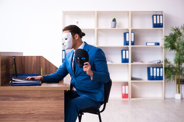 Young male employee wearing mask in the office