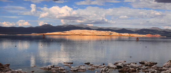 Bright lit hill under sunset by Mono lake in California
