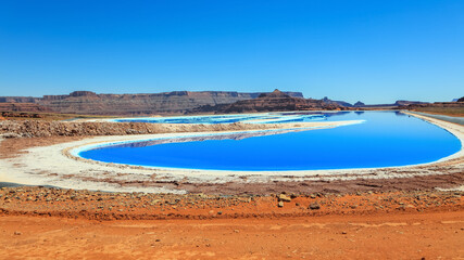 Bright blue Potash pond in Utah desert 
