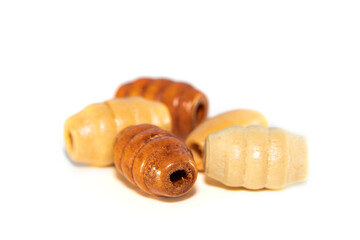 Close up shot of wooden beads on white background

