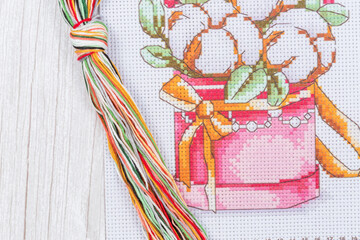 Cross-Stitch Set with printed canvas, needle and floss thread.
