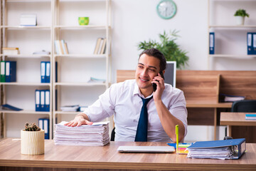 Young male employee working in the office