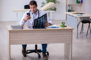 Young male doctor radiologist working in the clinic