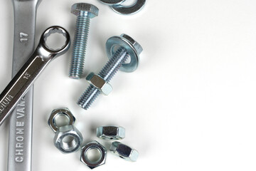 wrenches and bolts with metal nuts close up