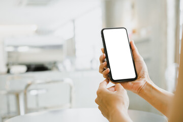 cell phone blank white screen mockup.woman hand holding texting using mobile on desk at office.background empty space for advertise.work people contact marketing business,technology