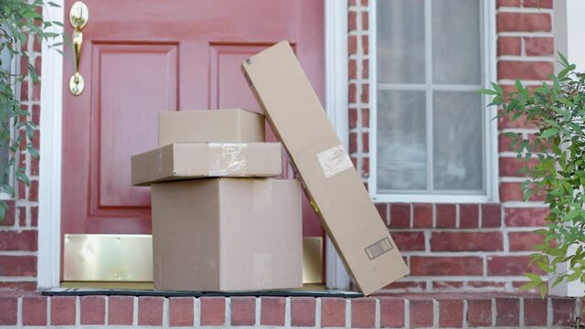 Packages left on a porch starting to stack up due to increased online purchasing are at increased risk for theft.