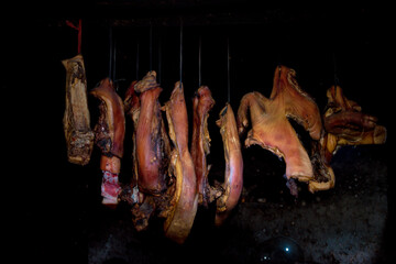  pork meat upstairs kitchen. Dry pork ( called Gac Bep pork) on dark background. This is one of Traditional dishes of ethnic H'Mong people in Ha Giang Province , Viet Nam
