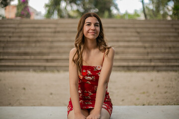 Portrait of a young woman in red dress