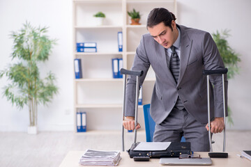 Young male employee after accident at workplace