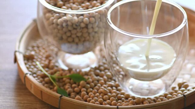 Pouring soymilk into a glass, Healthy drink