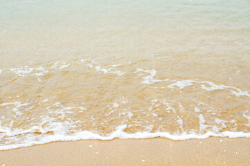 The sea waves hit the beach
