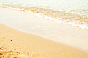 The sea waves hit the beach