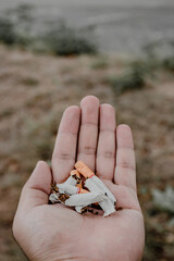 Cigarette on the palm. smoking stop concept