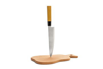 Kitchen knife stuck in the wood cutting board on white background.