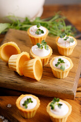 Canapes with light cream filling. Still life with microgreens. The concept of an appetizing snack.
