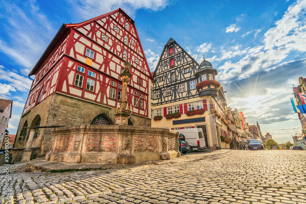 Poster traditional german architecture of rothenburg ob der tauber city with timbered houses in morning lig