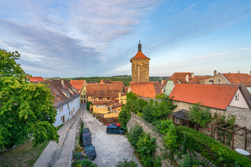 Obraz premium Tiled roofs, towers and half-timbered facades of Rothenburg ob der Tauber, view from the city wall
