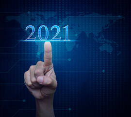 Hand pressing 2021 text over digital world map technology style, Business happy new year 2021 cover concept, Elements of this image furnished by NASA