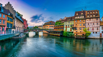 Old town water canal of Strasbourg, Alsace, France. Traditional half timbered houses of Petite...