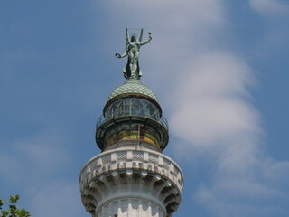 copper dome with the lantern and the statue of the Winged Victory in Vittoria Lighthouse in Trieste
